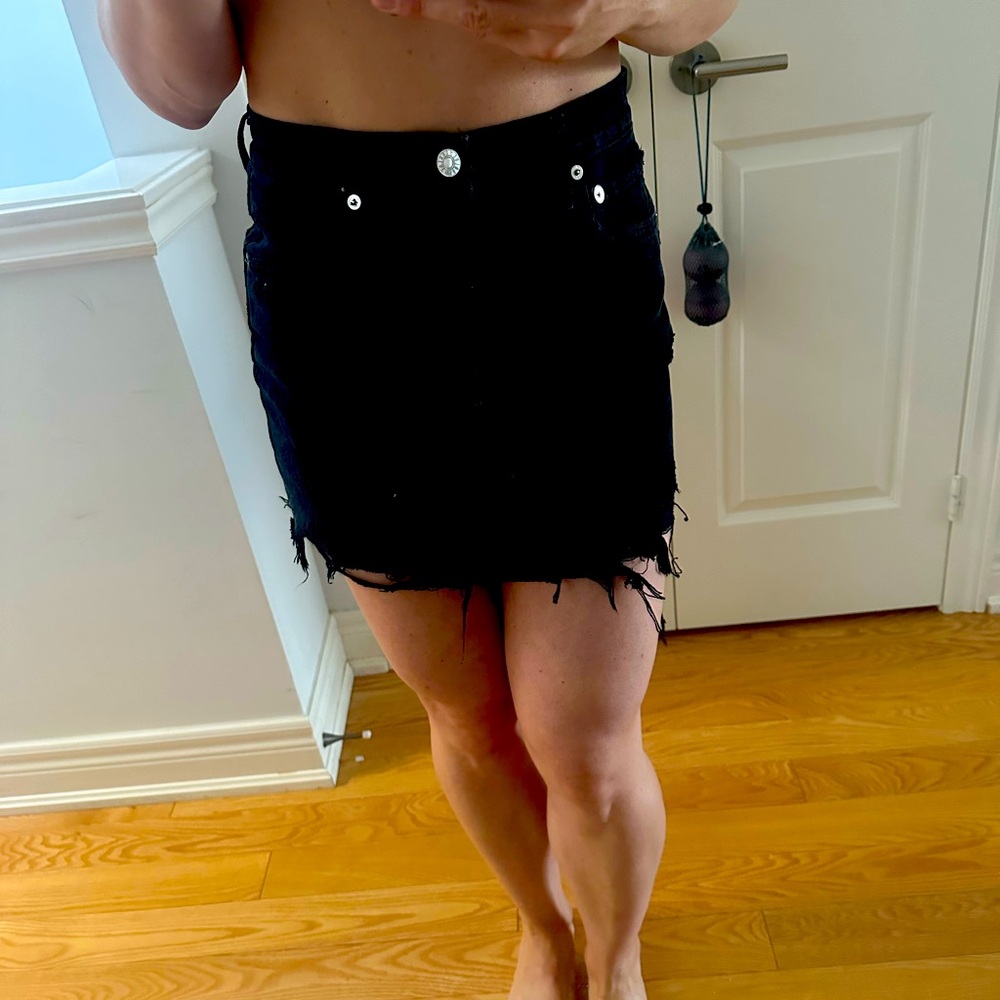 AGolde size 25 black distressed style denim skirt. Worn once. Fits true tosize.